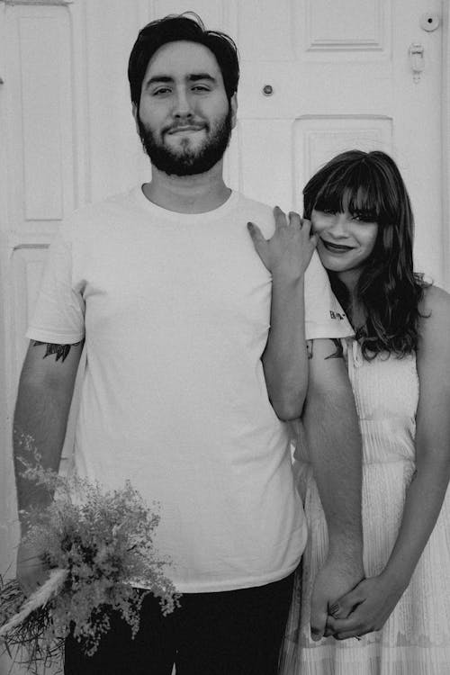 Grayscale Photo of a Smiling Couple