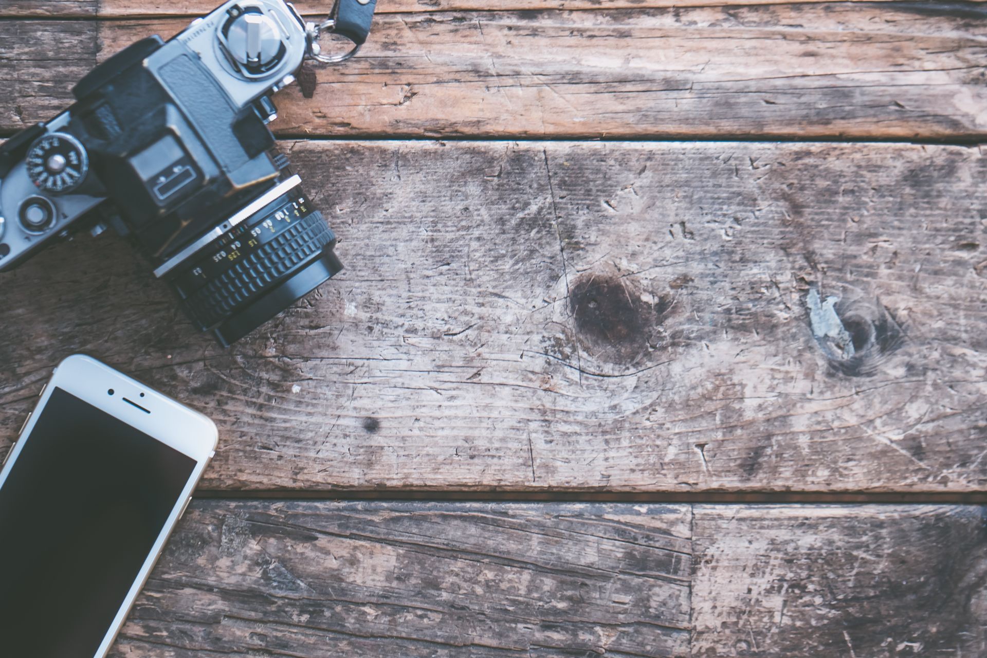 Flat-lay Photography of Iphone and Slr Camera