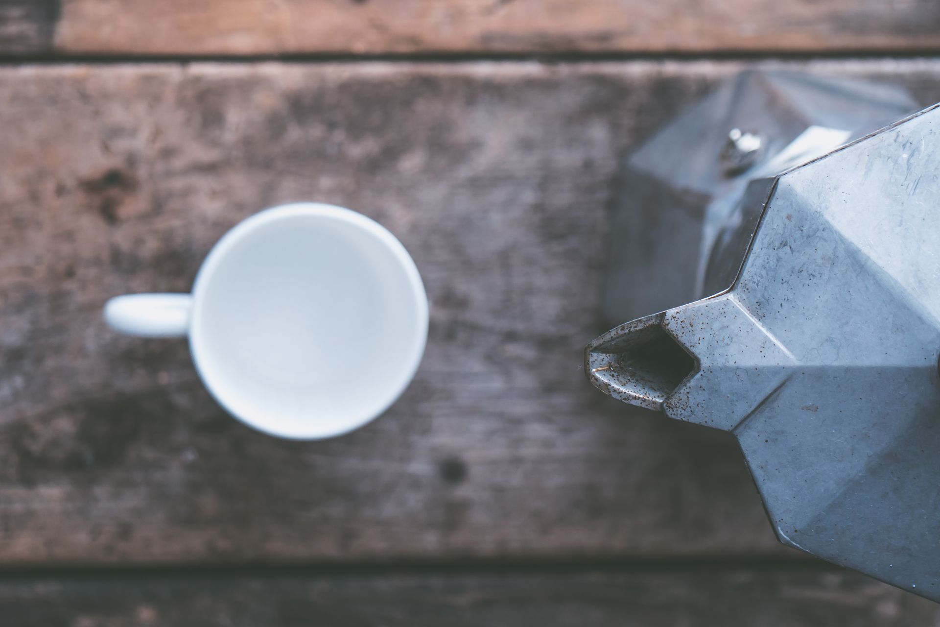 White Coffee Mug Near at Moka Pot