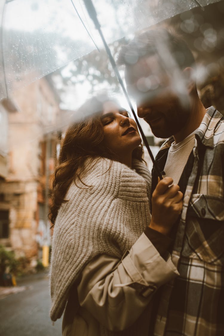 A Couple Under An Umbrella