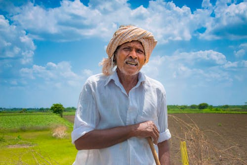 Tired Farmer in White Shirt