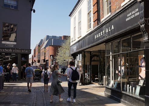 Bustling street scene with pedestrians, shops, and vibrant urban life.