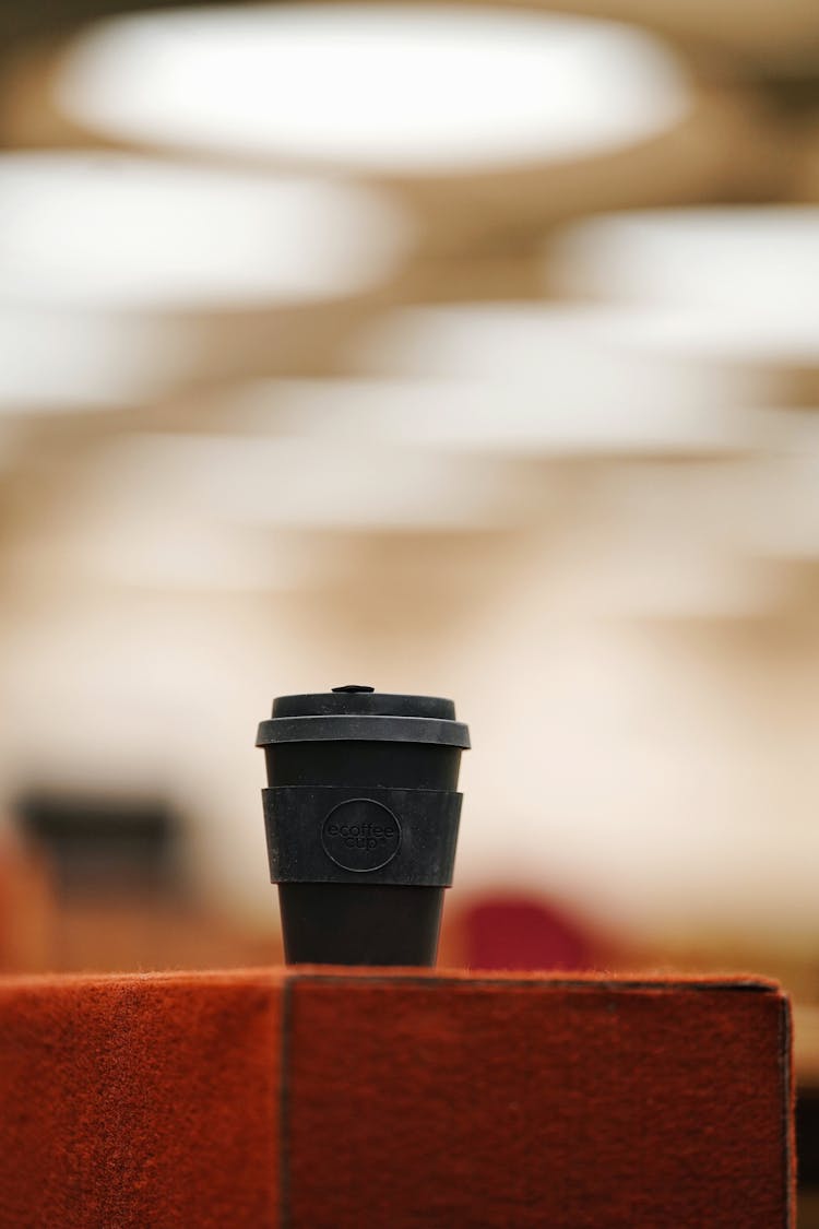 Reusable Coffee Cup On Blur Background