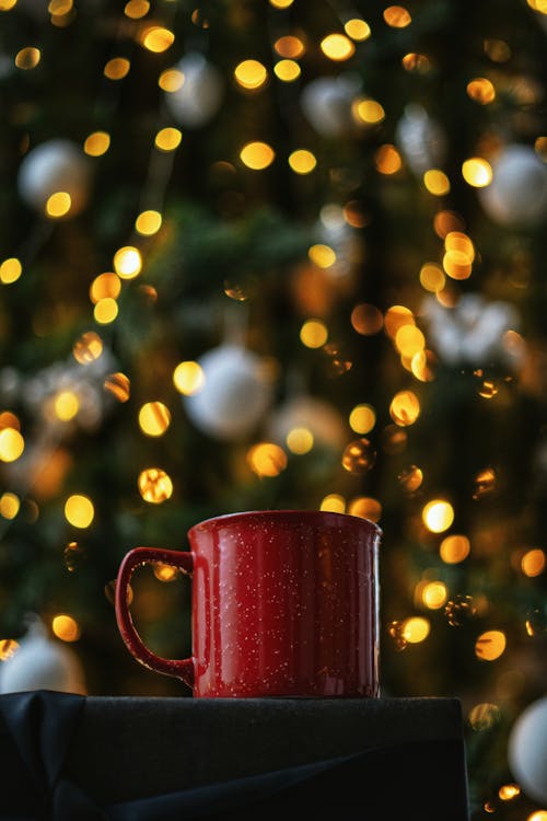 Red Cup with a Christmas Tree in the Background 