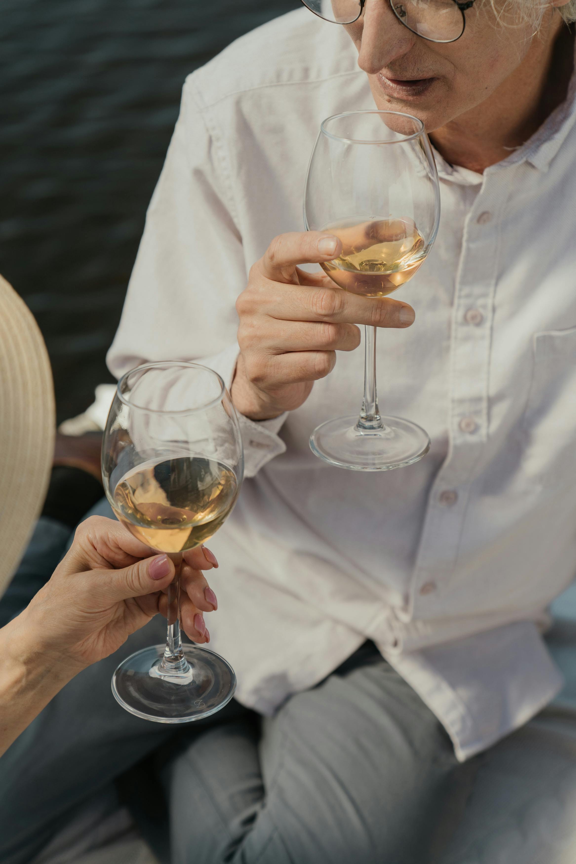 couple drinking champagne over river