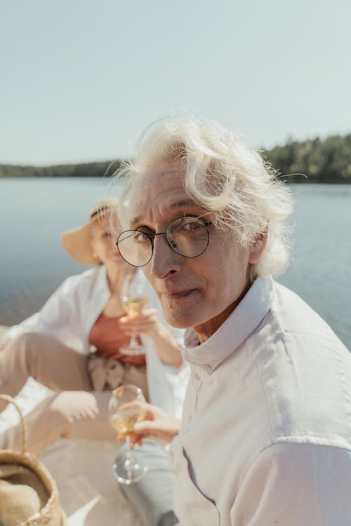 Woman in White Dress Shirt Wearing Eyeglasses