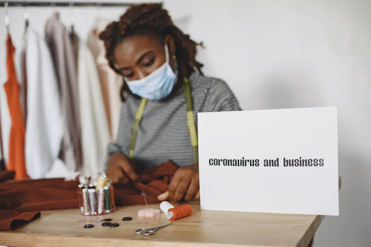 Photo Of A Seamstress Wearing A Face Mask