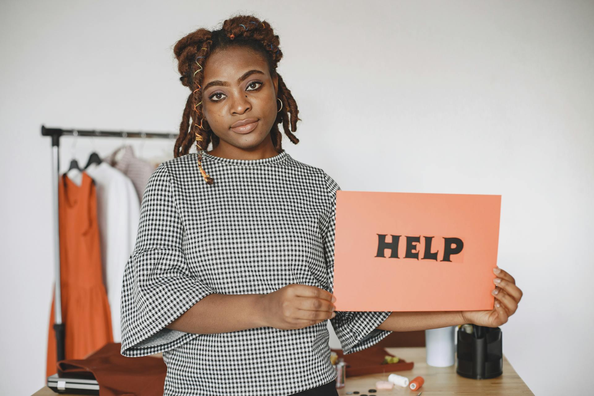 Businesswoman Holding Sign Saying Help