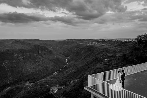 Bride and Groom in a Scenery with a Valley