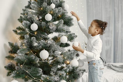 Girl Hanging Christmas Balls