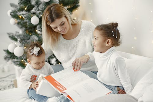 Mother and Daughters Together on Sofa