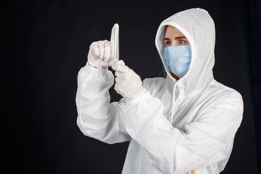 Person in Protection Suit Holding Probe