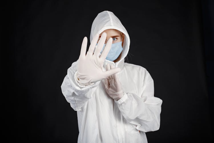 Person In Protective Suit Against Coronavirus