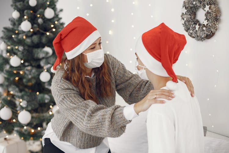 Family In Face Masks Celebrating New Year