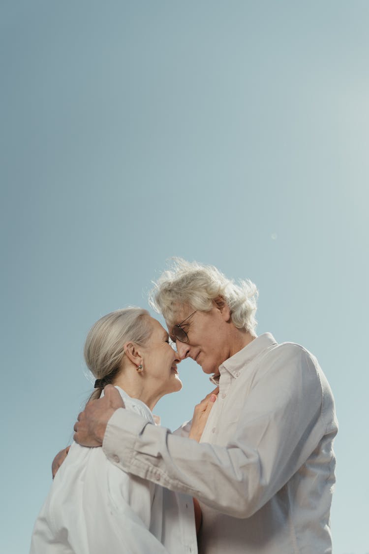 An Elderly Couple Embracing