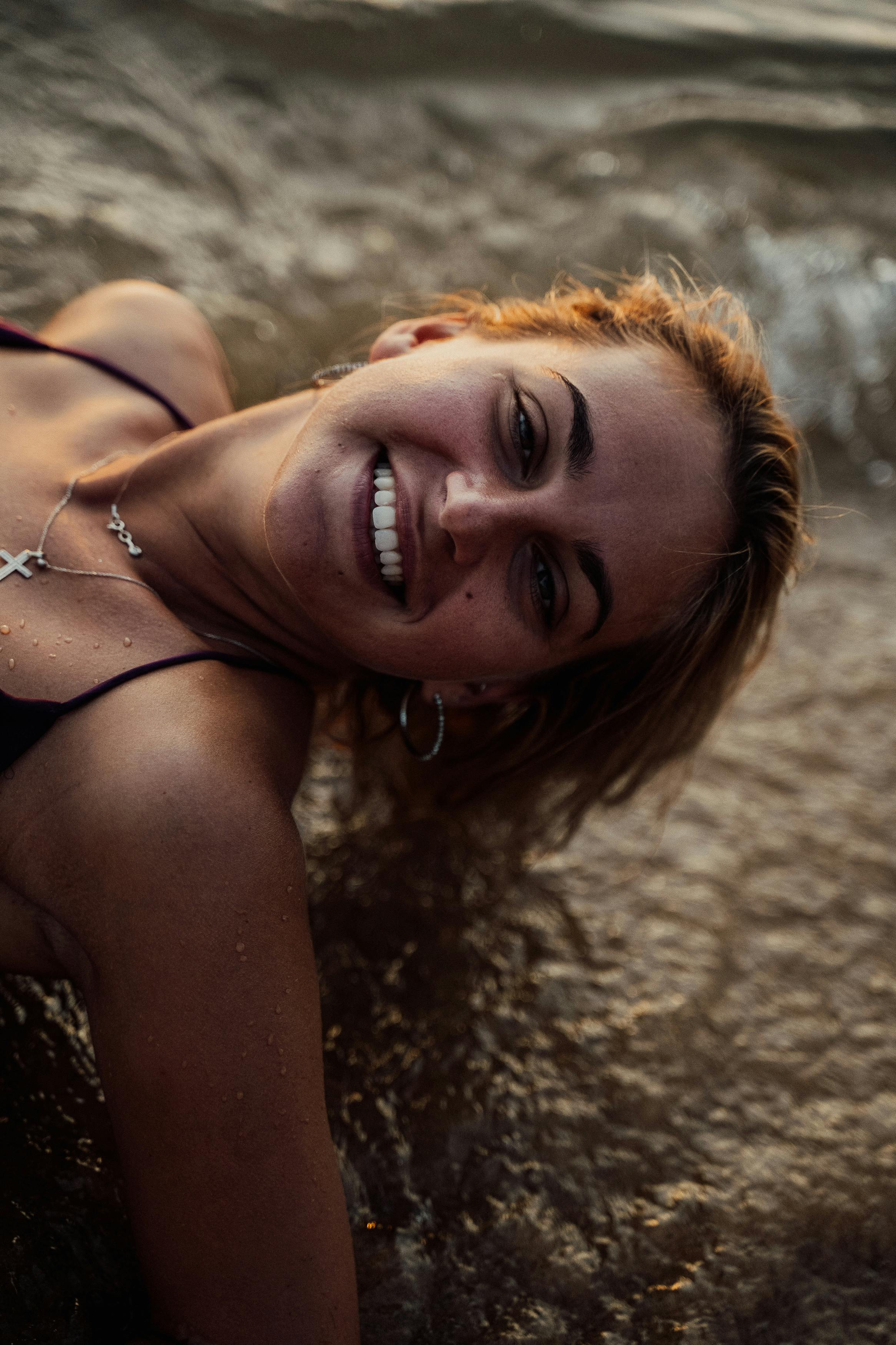 a woman in black top swimming