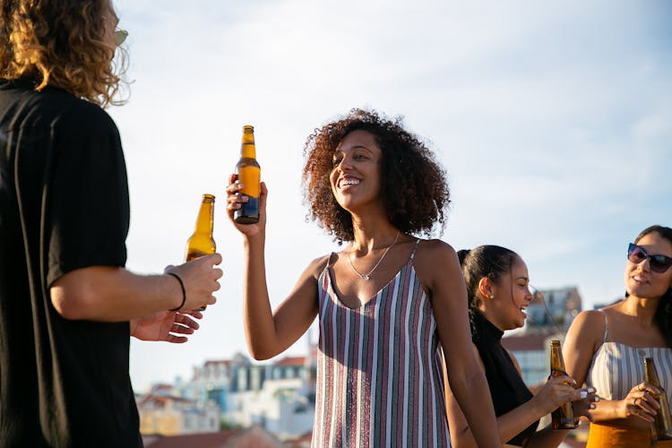 Smiling People Relaxing Outdoors Drinking Beer