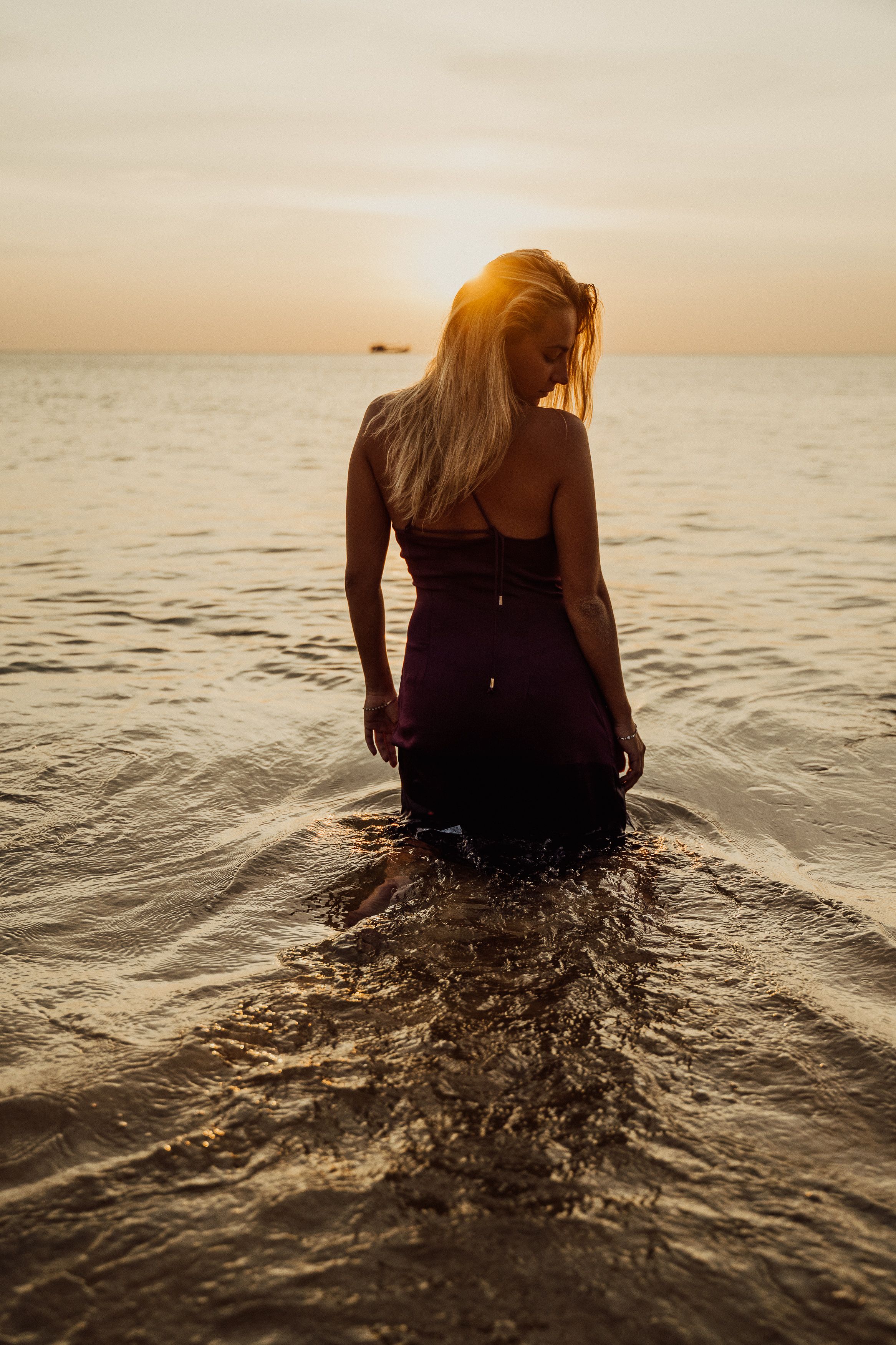 Silhouette of Person Standing on Beach during Sunset · Free Stock Photo
