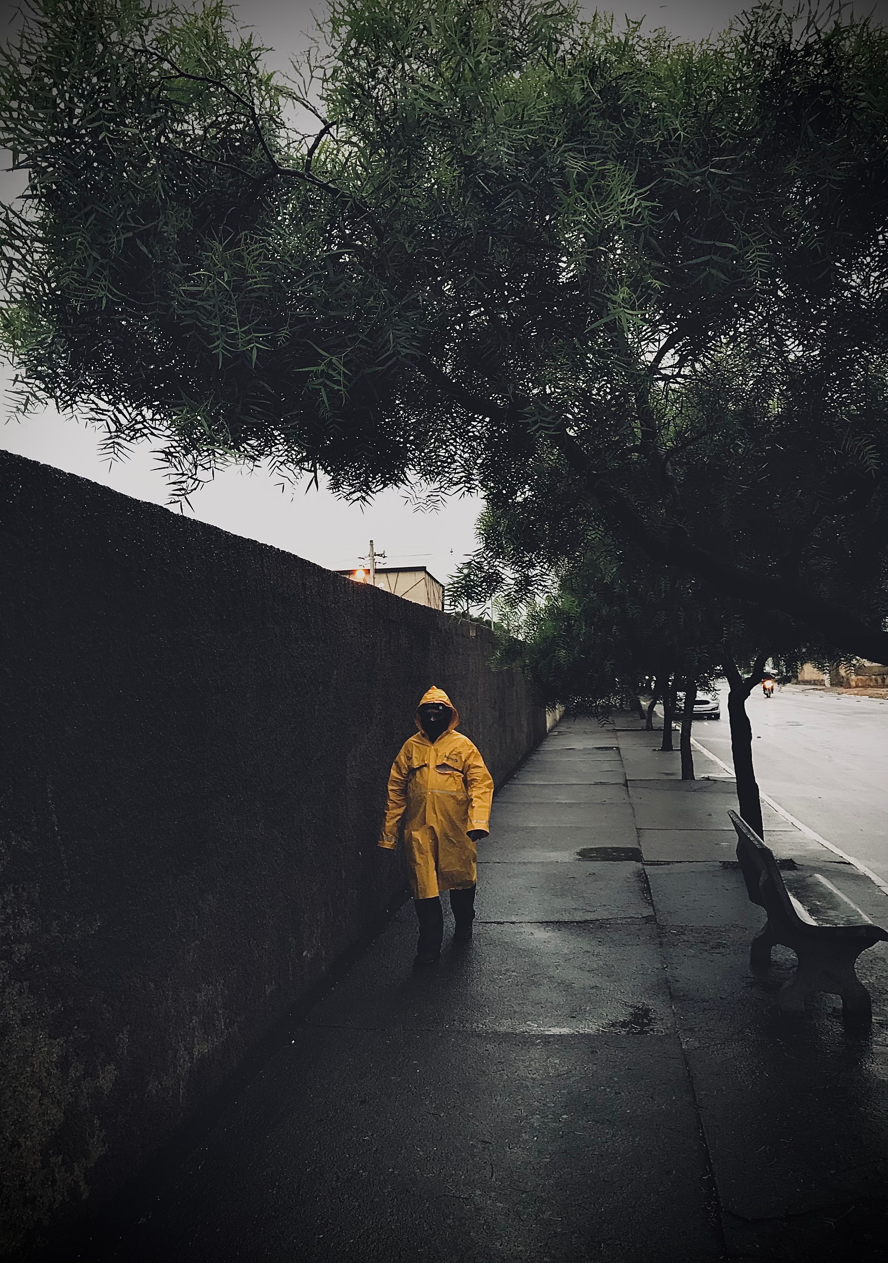 Person in Yellow Raincoat Walking on Sidewalk · Free Stock Photo