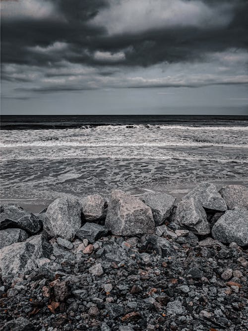 Gray and White Stones on Seashore Under the Gray Clouds
