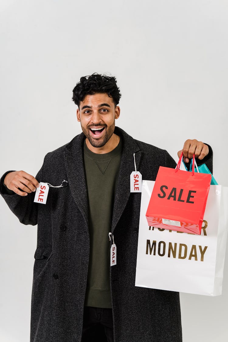 Man Feeling Happy With His Gray Coat On Sale