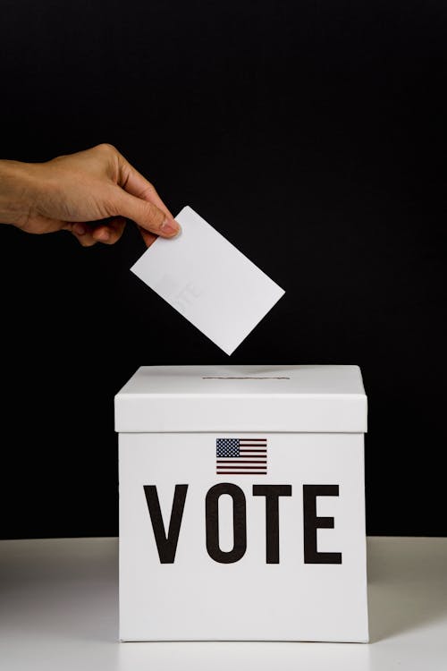 Free Photo Of Person Dropping A Vote Stock Photo