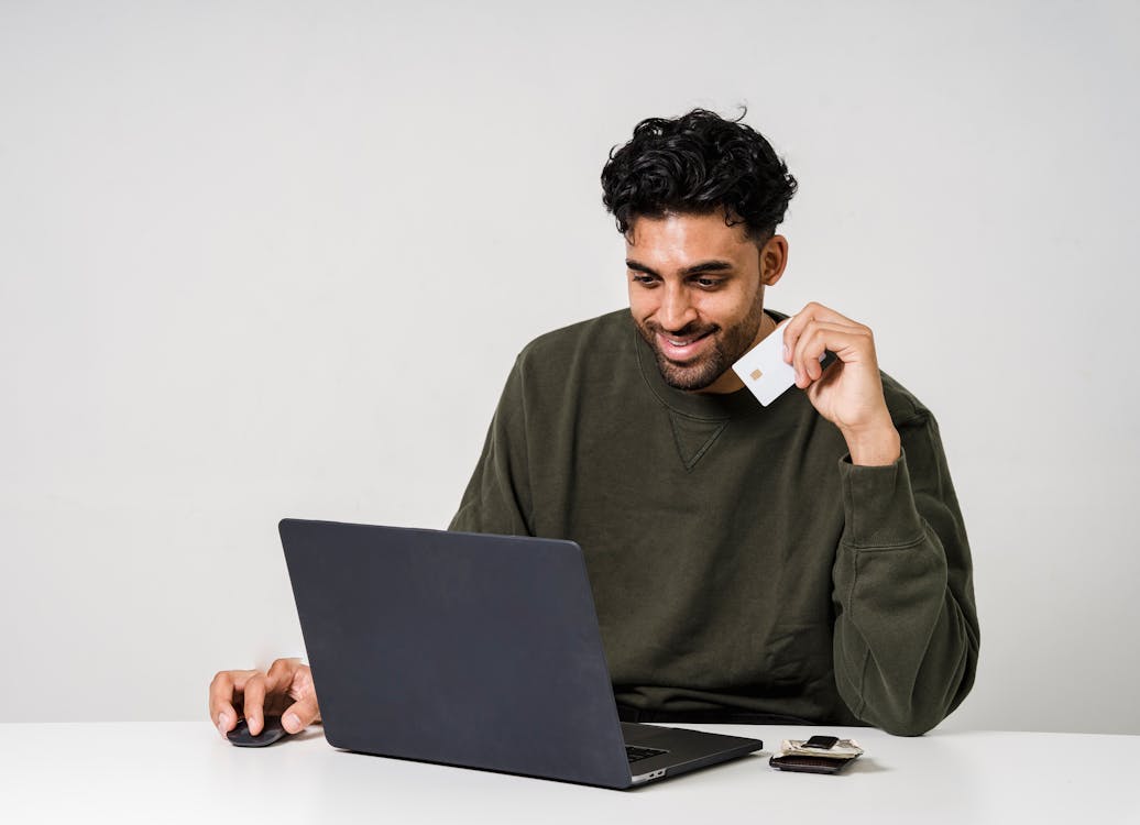 Free Man Holding His Credit Card Stock Photo