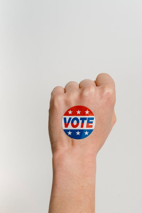 Free Person's Fist With Vote Sticker  Stock Photo