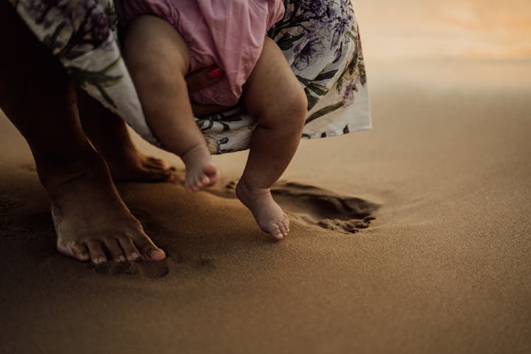 Baby Stepping On Sand