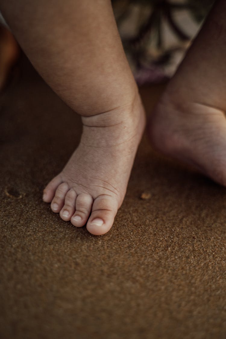 Baby's Feet On Sand