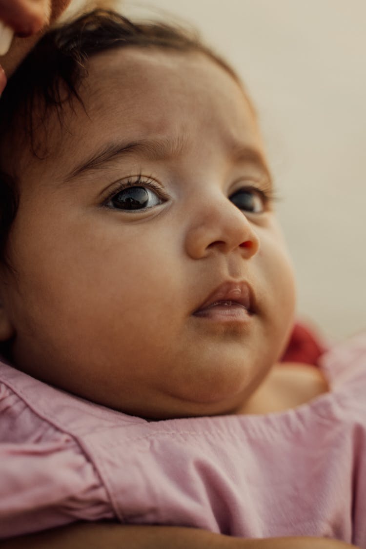 Baby Girl's Face In Close Up Photography