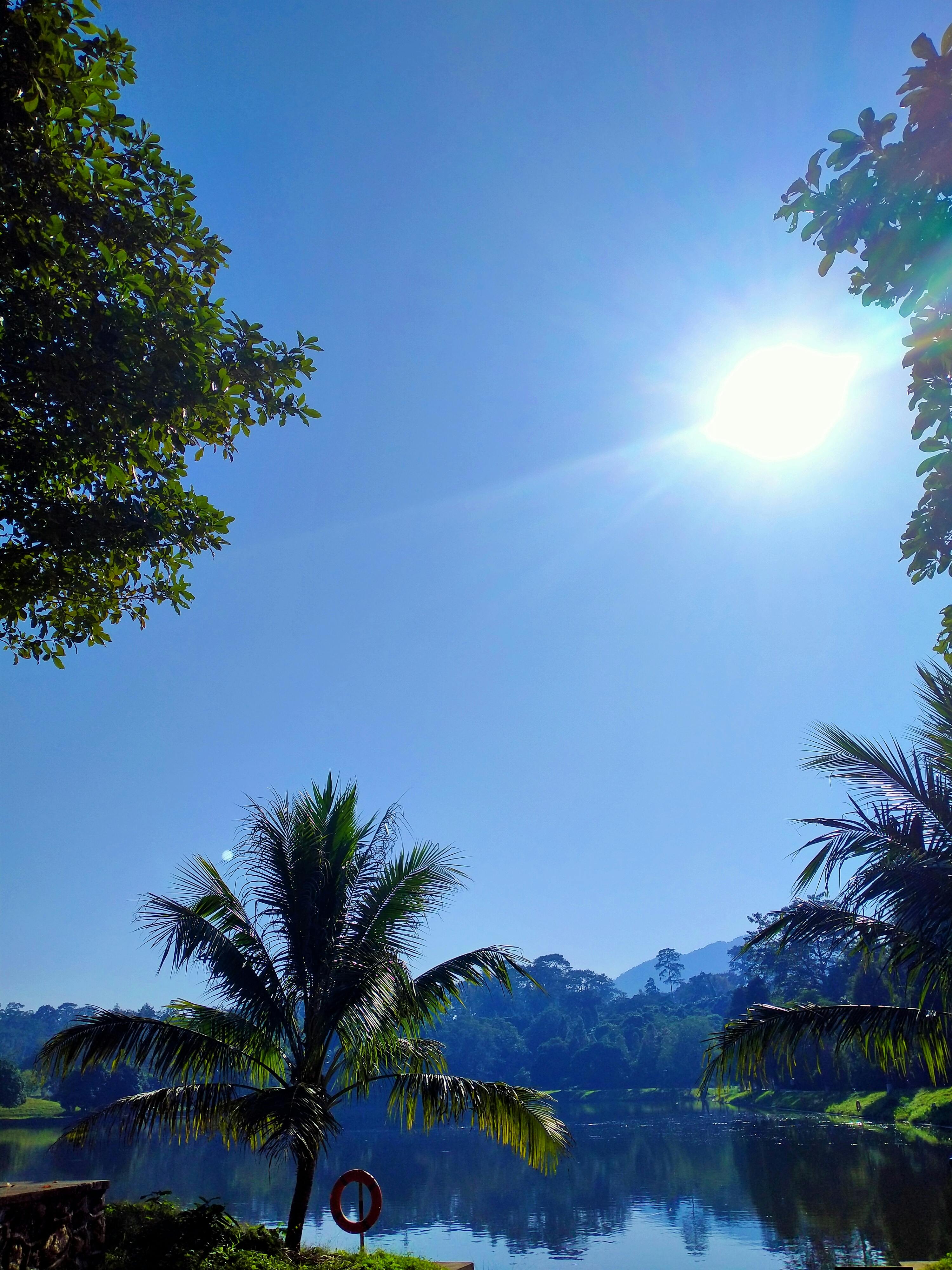 Cyclist eating a snack and drinking from a bottle during a ride