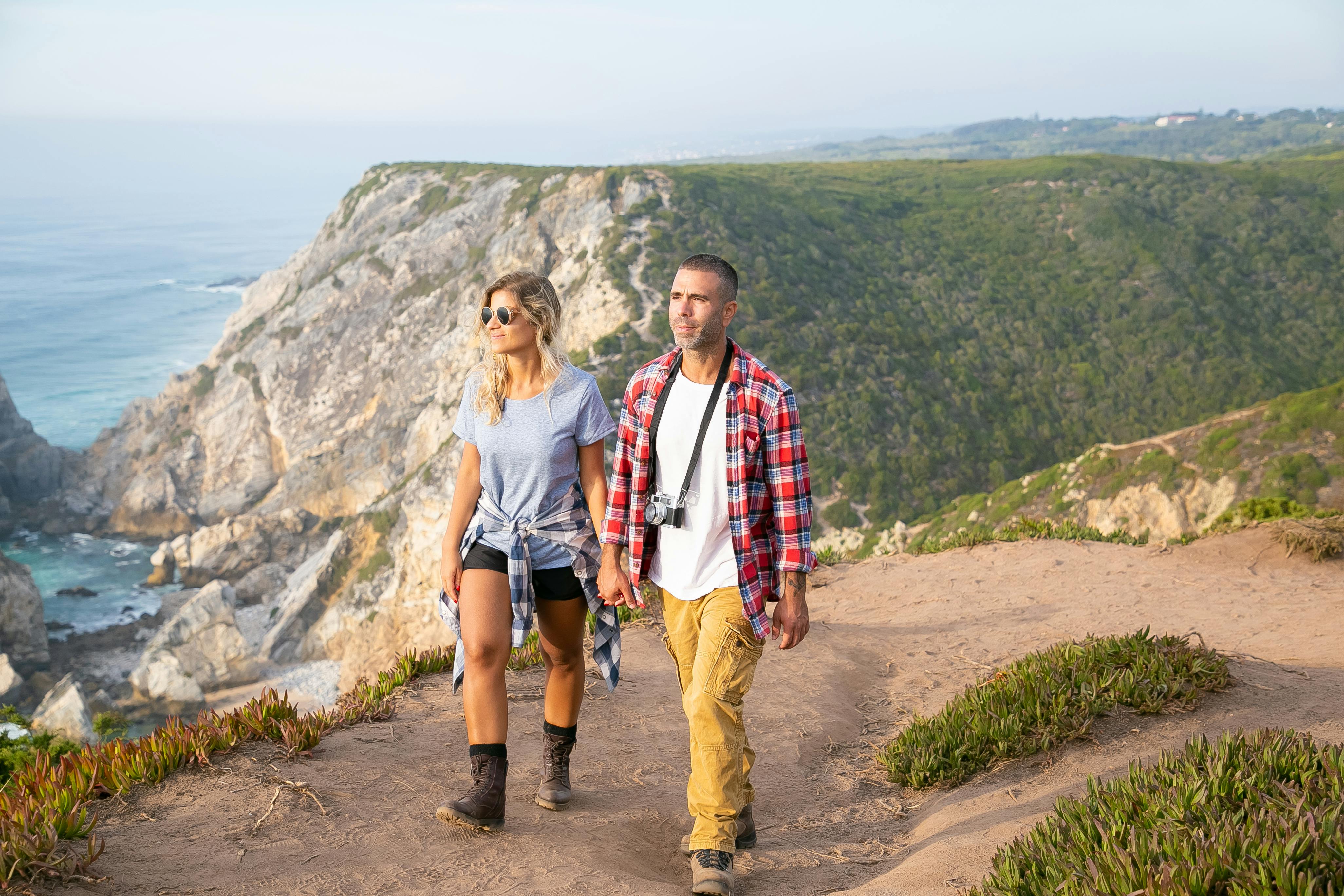 a couple walking while holding each others hand