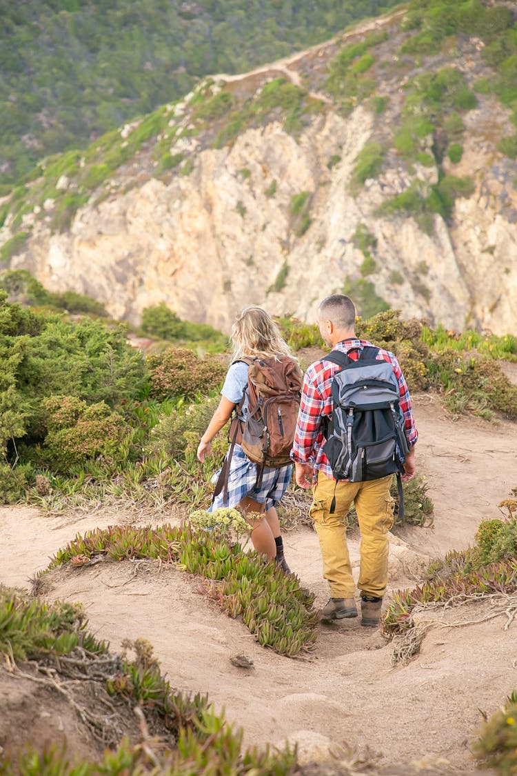 Hikers Walking Down The Trail