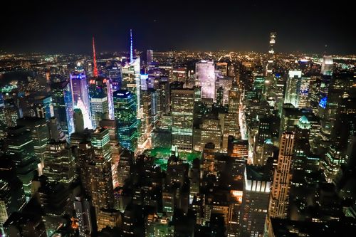 Free Stunning aerial view of city lights illuminating the skyscrapers at night. Stock Photo