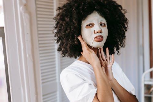 Young woman doing cosmetic procedure at home