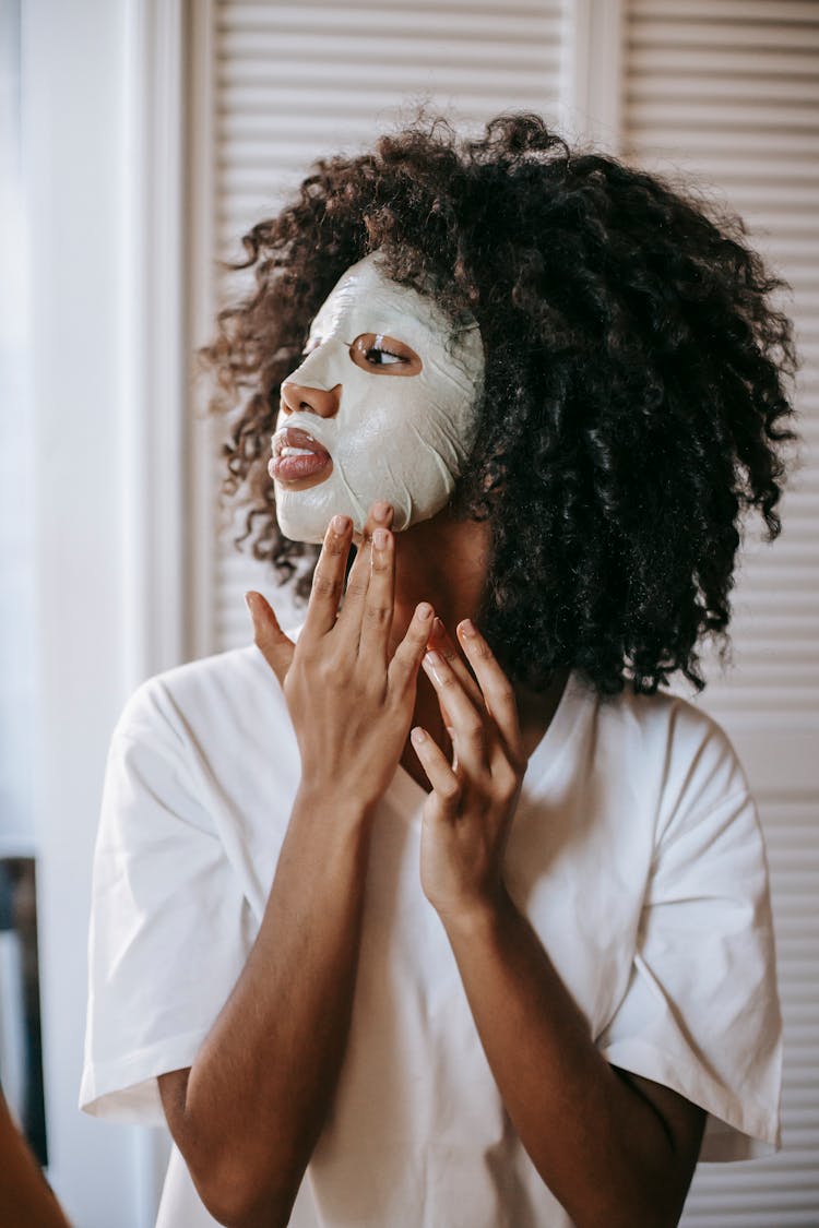 Young Woman With Cosmetic Sheet Mask On Face