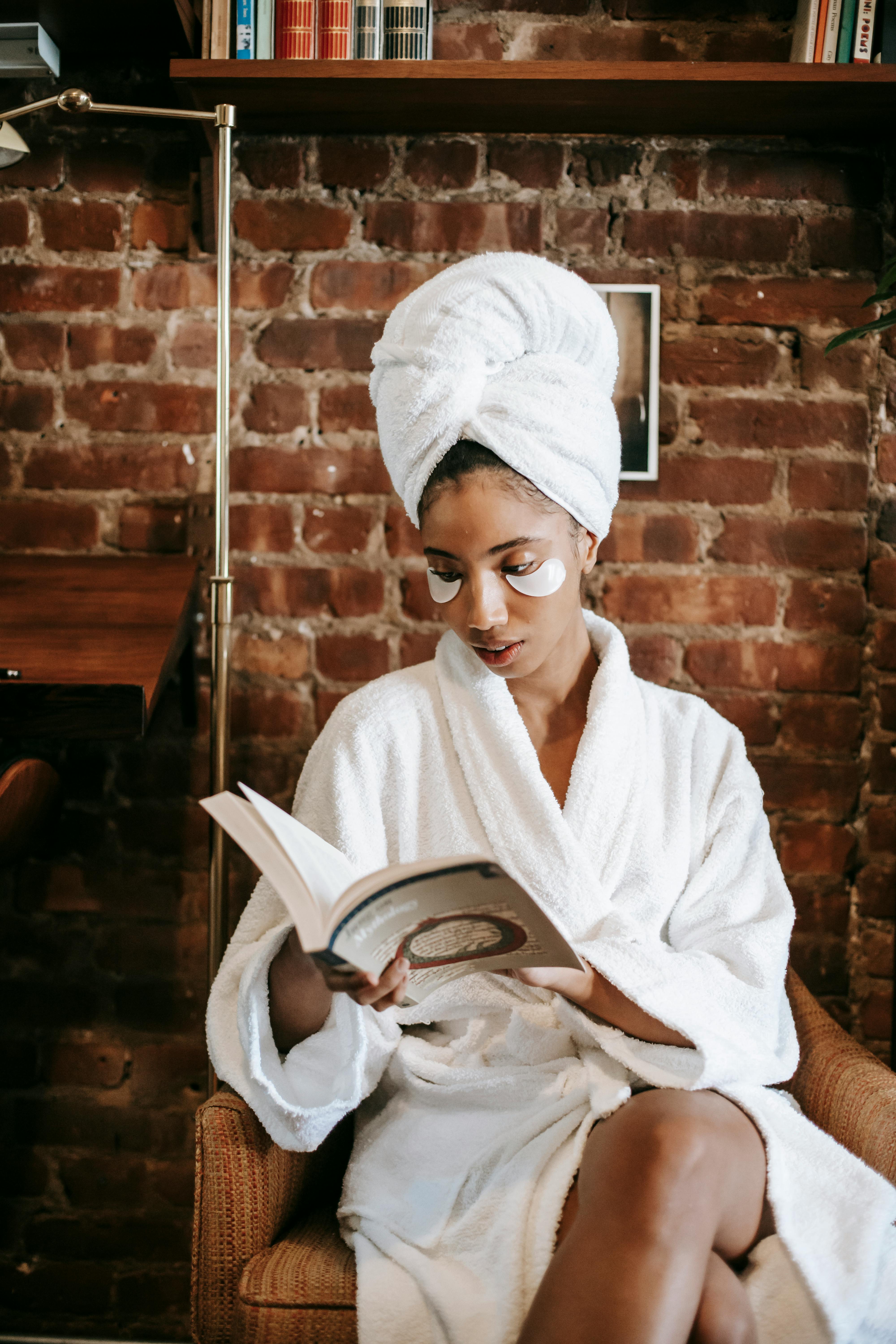 Woman washing face with foaming cleanser