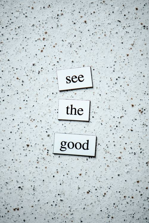 Free Inspiring words 'See the Good' displayed on a speckled backdrop. Stock Photo