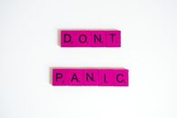 Close-up Photo of Pink Scrabble Tiles