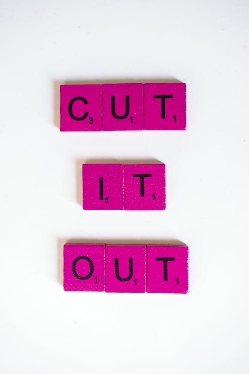 Close Up Shot of a Pink Scrabble Tiles