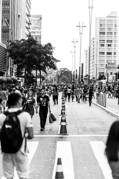 Grayscale Photo of People Walking on the Street