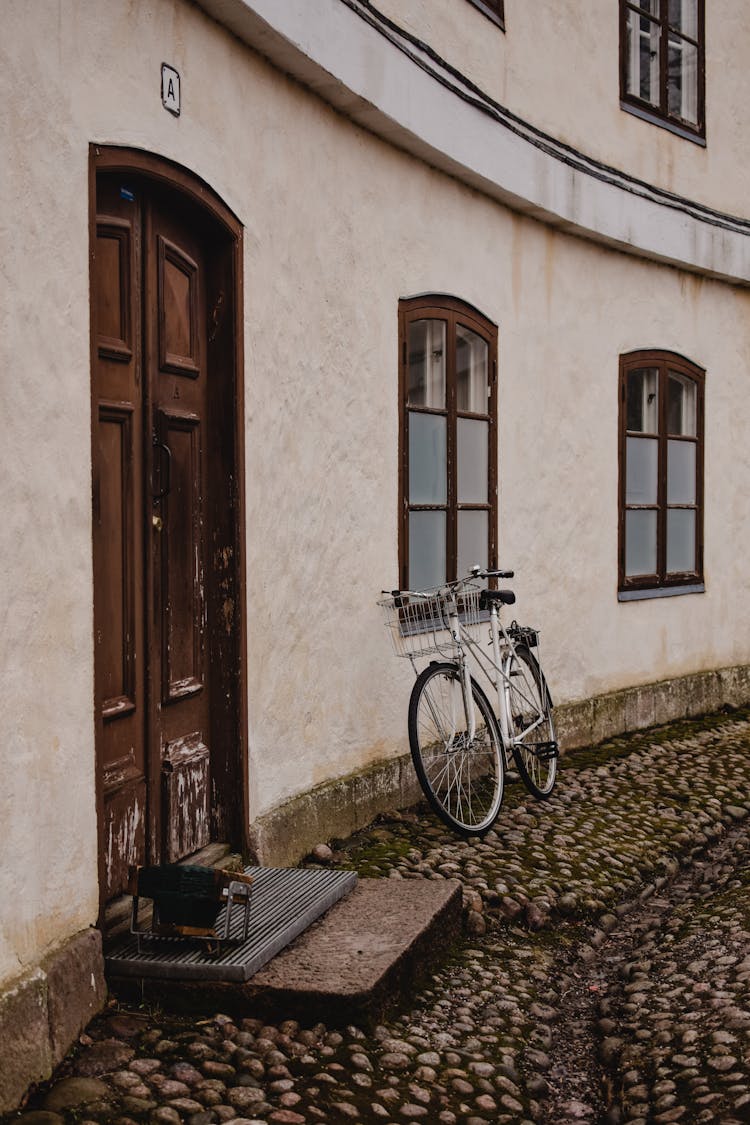 A Bicycle Parked Outside The House