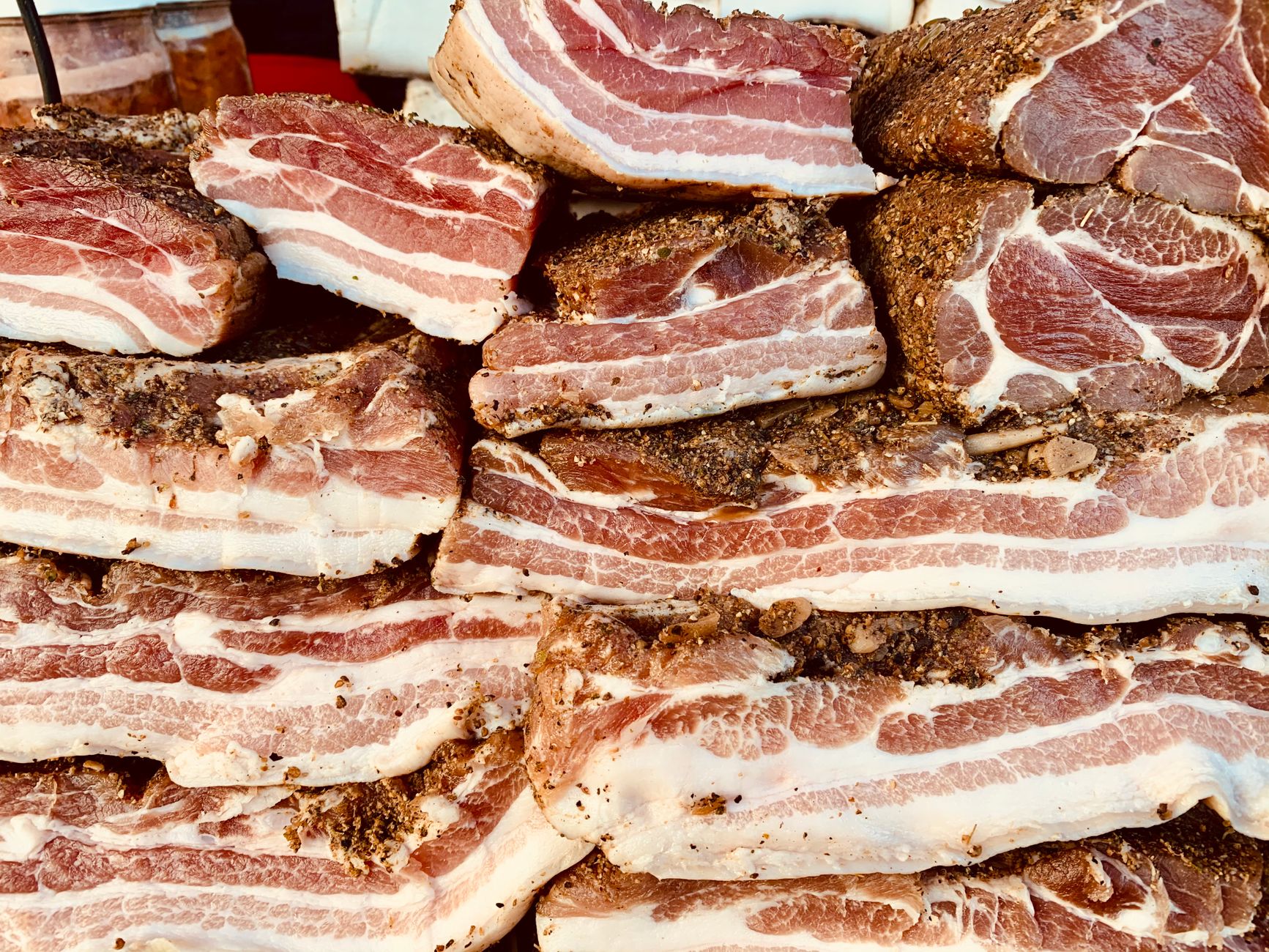 Freshly sliced uncured ham on a wooden board