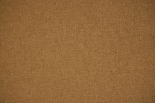 Detailed close-up of a brown textile fabric showing its texture and pattern.