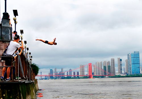 Man Diving on Body of Water