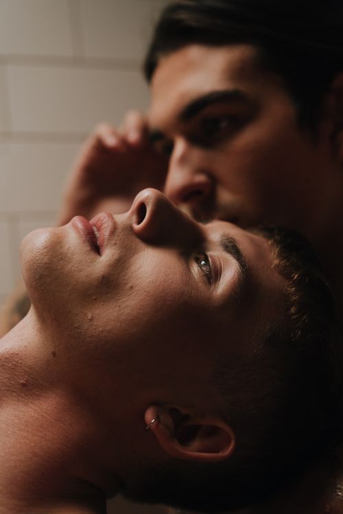 Free Close-up of a thoughtful, affectionate couple embracing indoors. Stock Photo