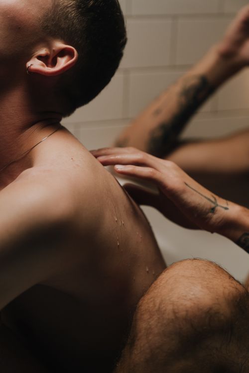 Free Artistic composition capturing an intimate moment with warm tones and soft lighting. Stock Photo