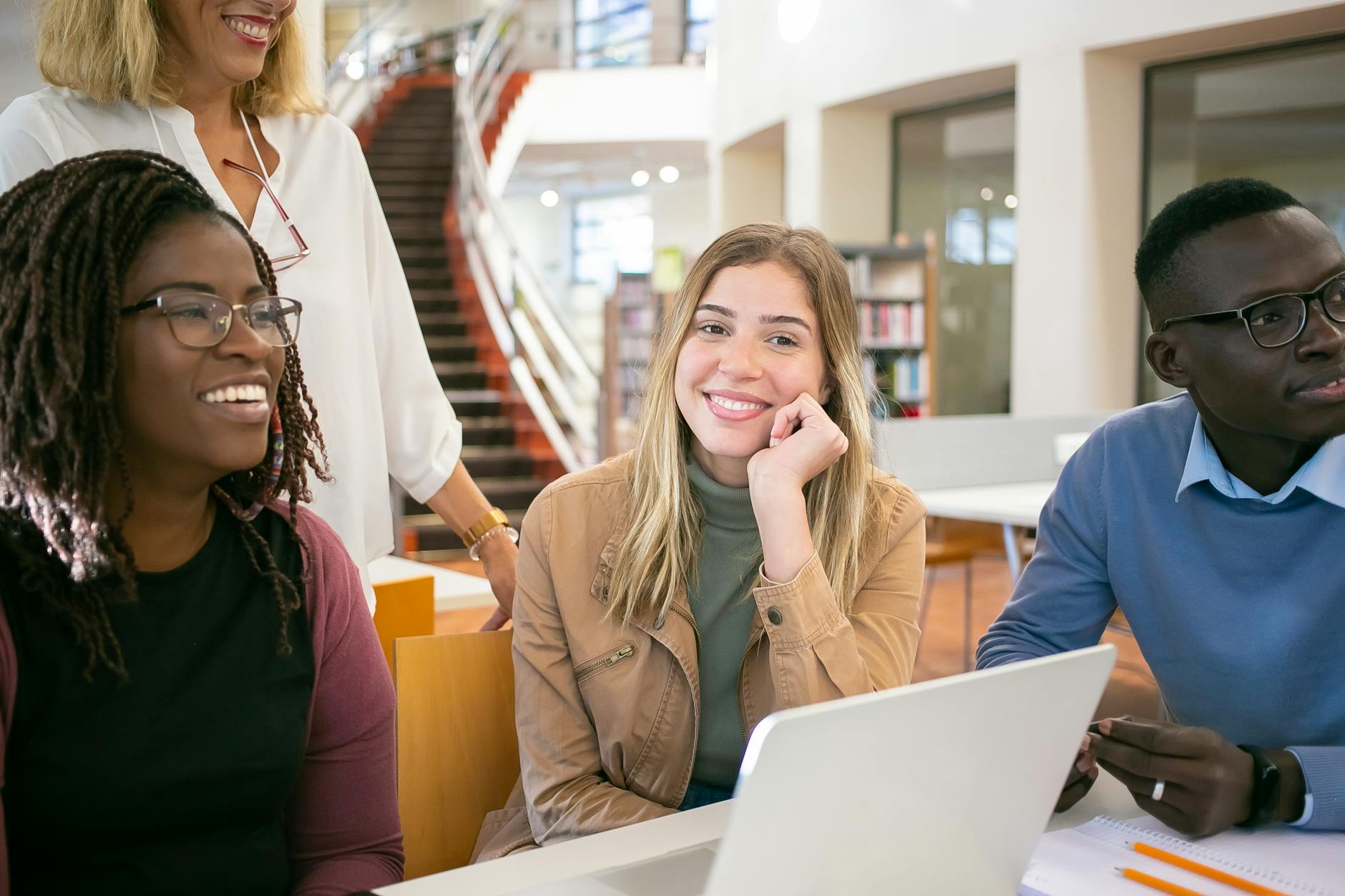 Diverse group of researchers collaborating on a project, symbolizing academic collaboration