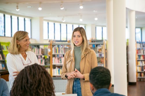 Young student making presentation to classmates and teacher